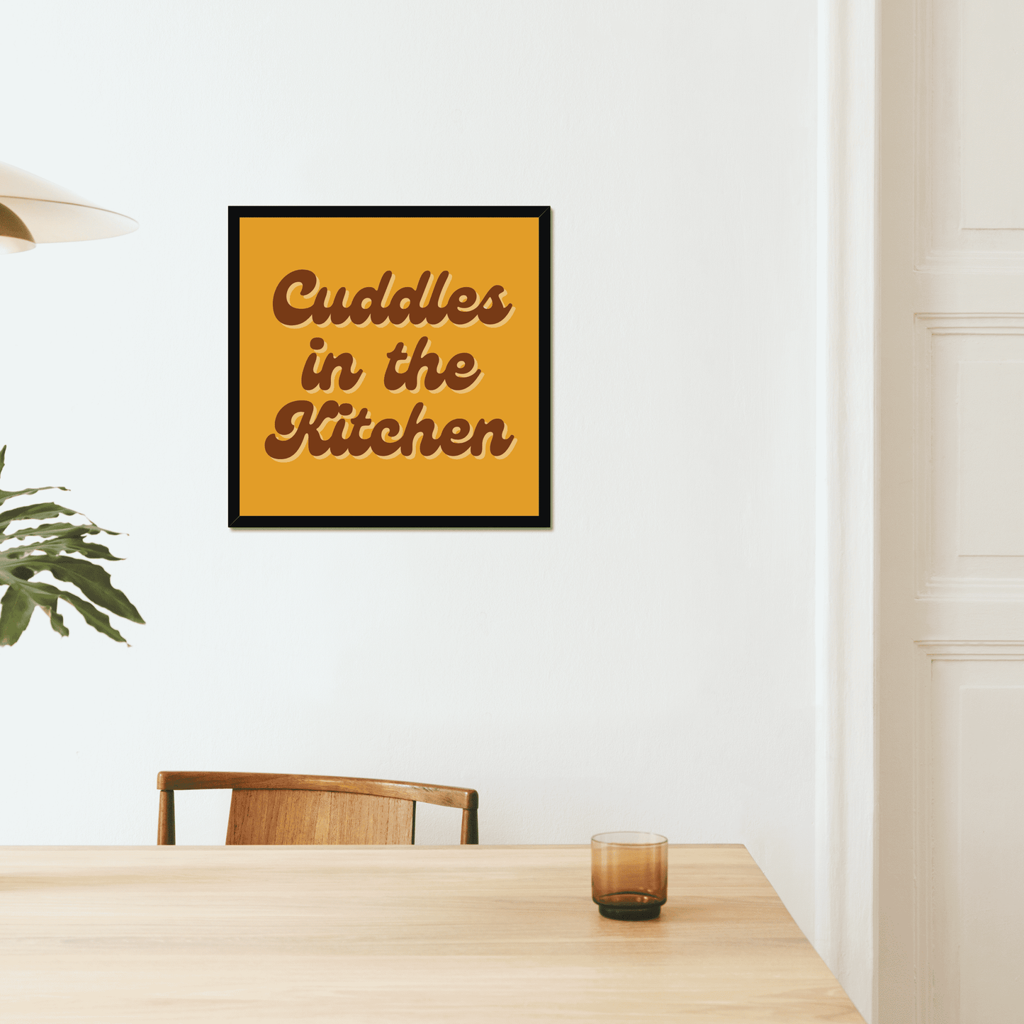 Cuddles in the kitchen art print. A bold and quirky print to make a fun statement in your home. A mustard orange yellow background with a retro brown font. We love this Arctic Monkeys, Mardy Bum inspired print.