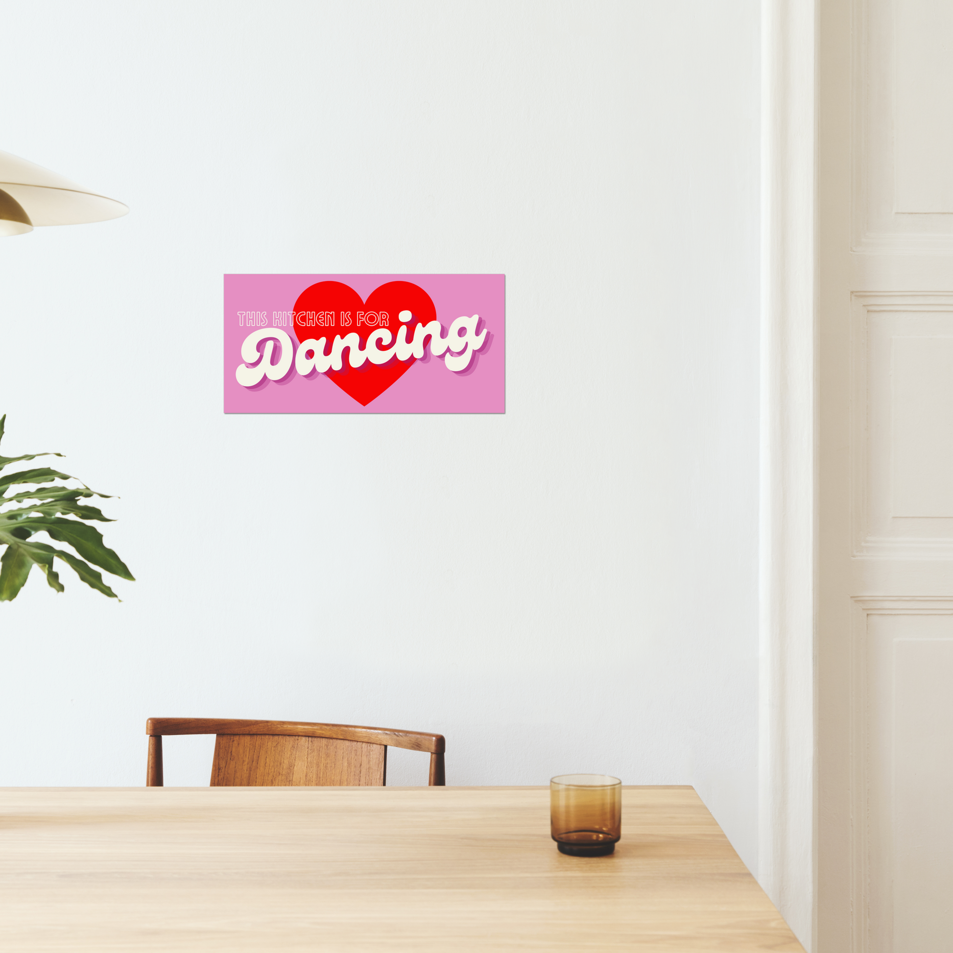 This Kitchen Is For Dancing is the perfect addition to any kitchen with a sense of fun and quirkiness. The catchy phrase and retro pink style make it a truly unique art print that is sure to bring a smile to your face every time you see it.