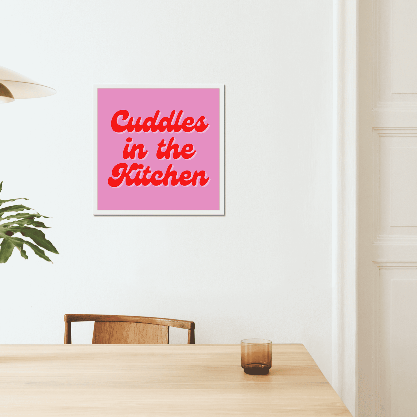 Cuddles in the kitchen art print. A bright and quirky print to make a fun statement in your home. A pink background with a red retro font. We love this Arctic Monkeys, Mardy Bum inspired print.